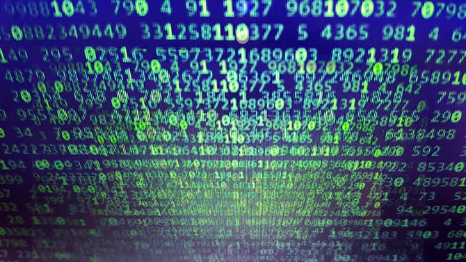 an image of a computer screen with scattered numbers, suggesting a data breach